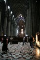 Duomo in Milan with service in full flight (plus lots of tourists)
